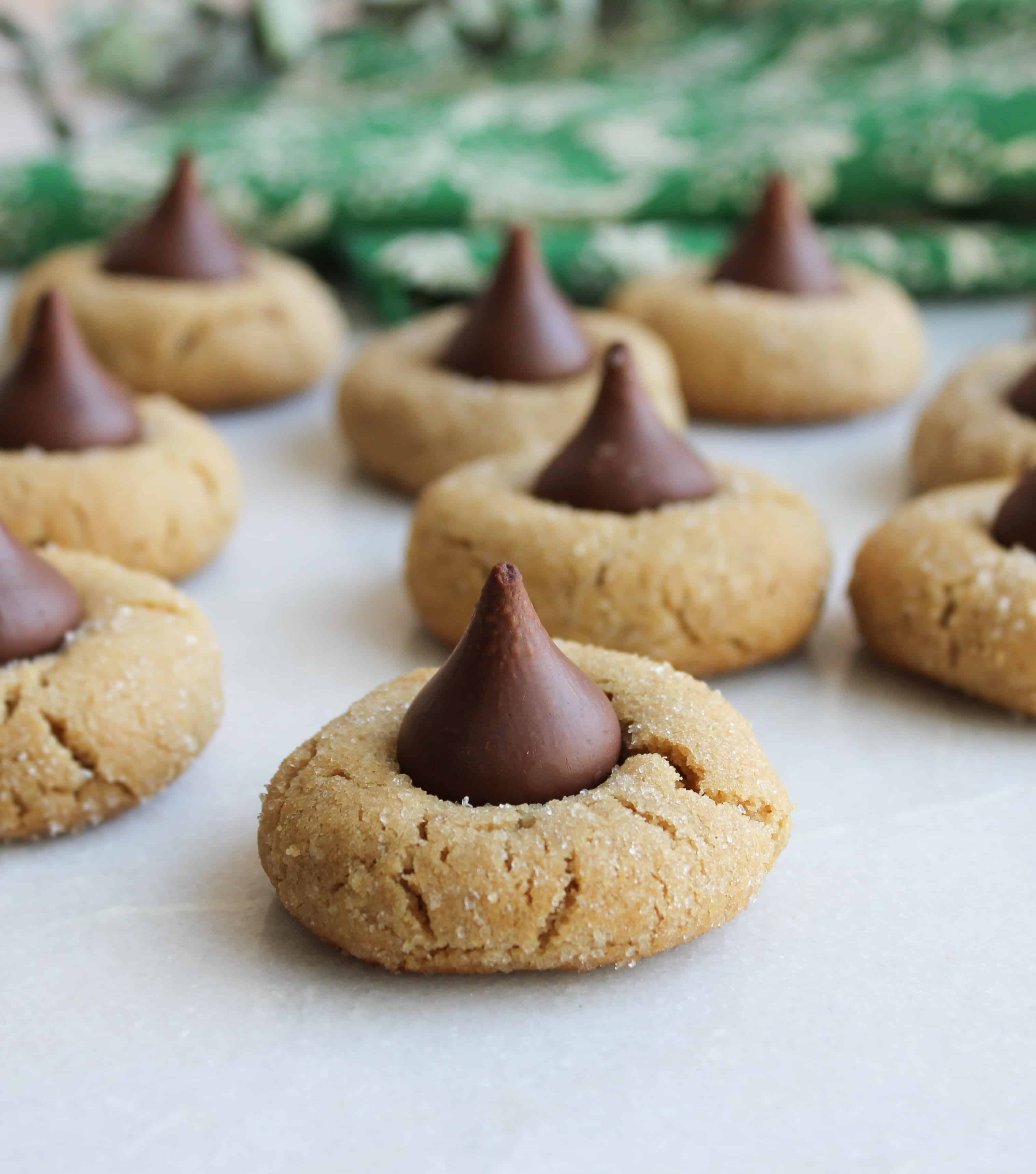 Peanut butter blossom cookies on white background 