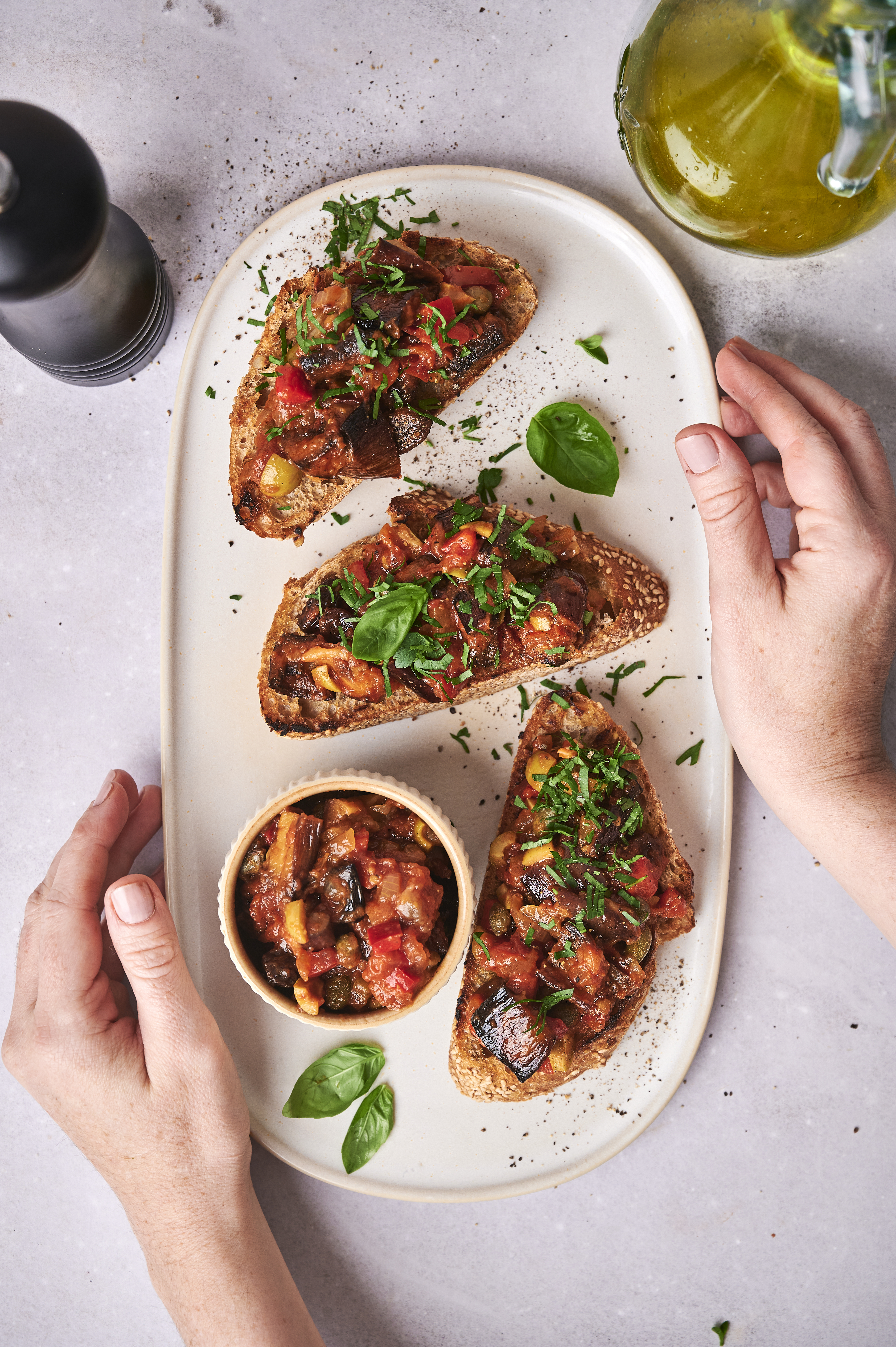 caponata on bread on a large plate 