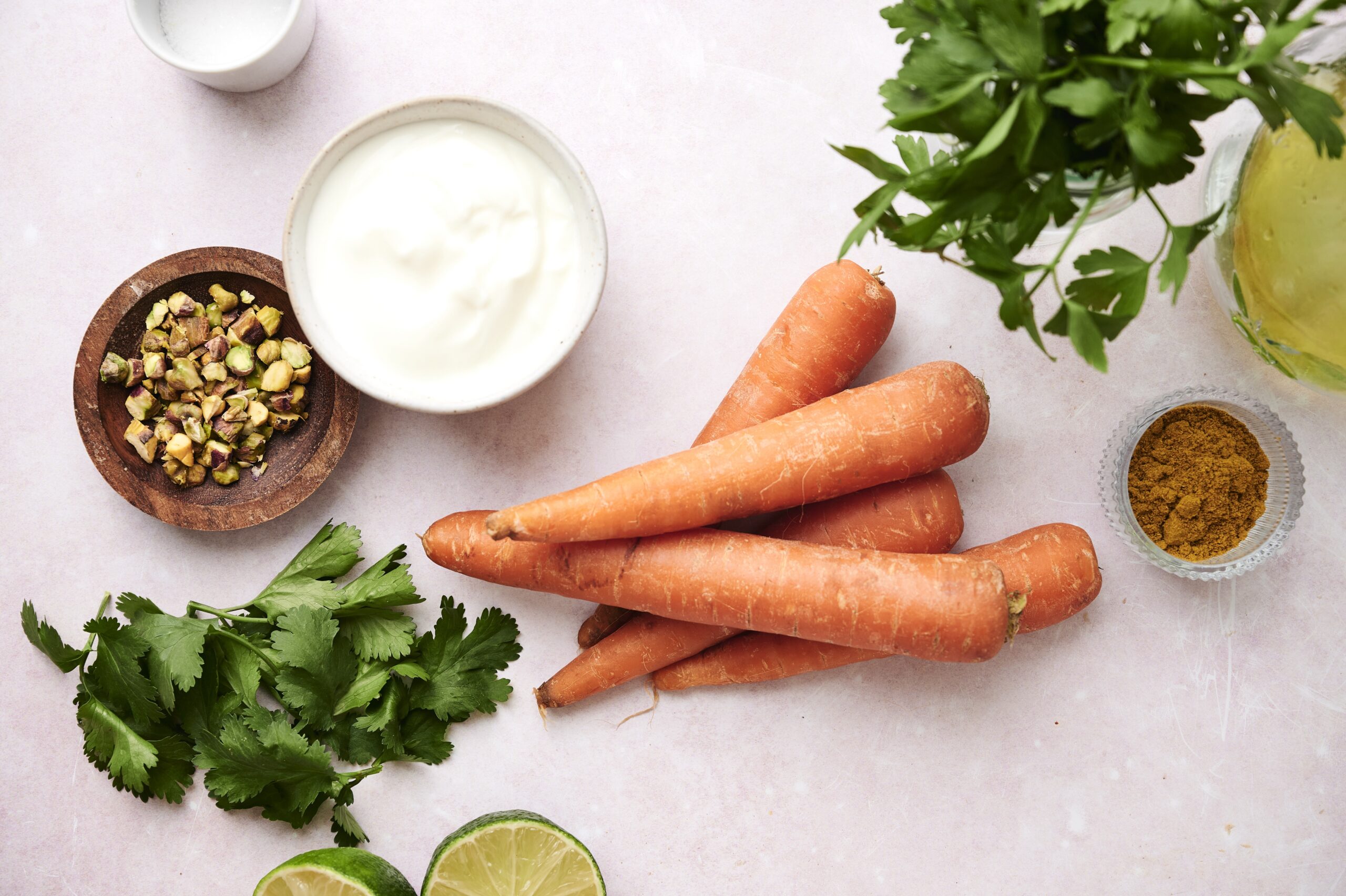 Ingredients for roasted curry carrots with herb yogurt 