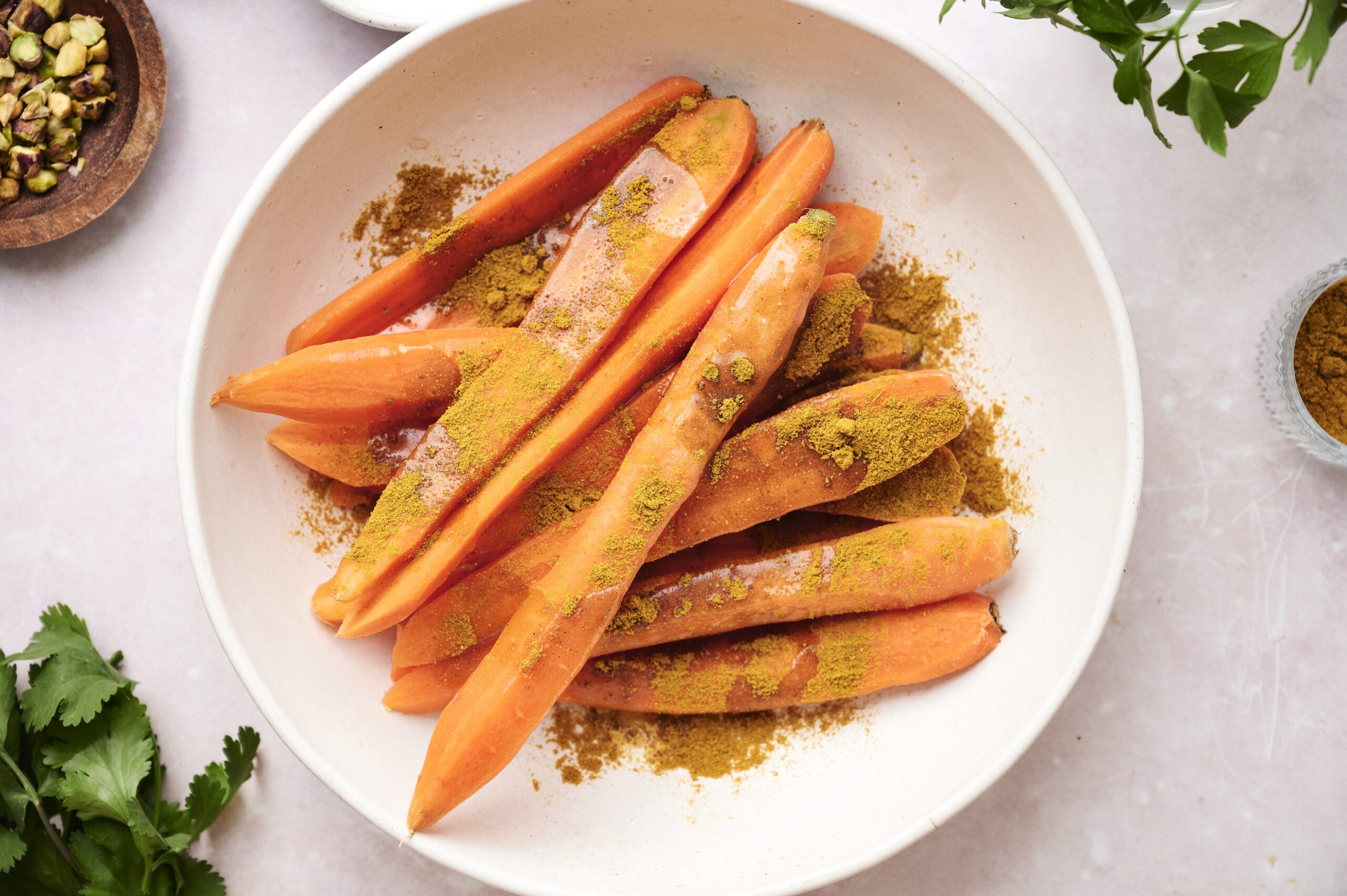 Preparing curry roasted carrots 