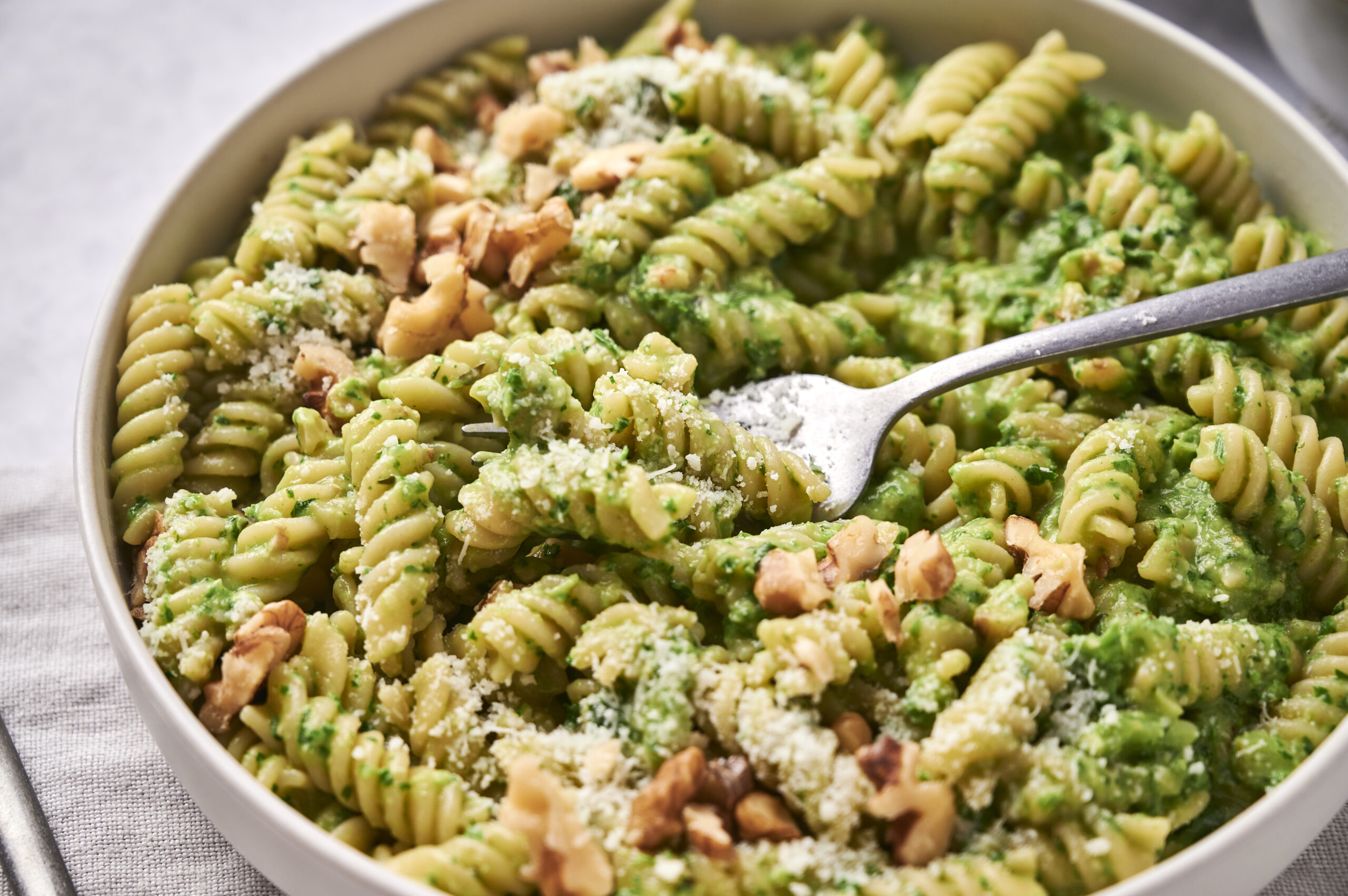 Creamy kale pesto pasta in bowl