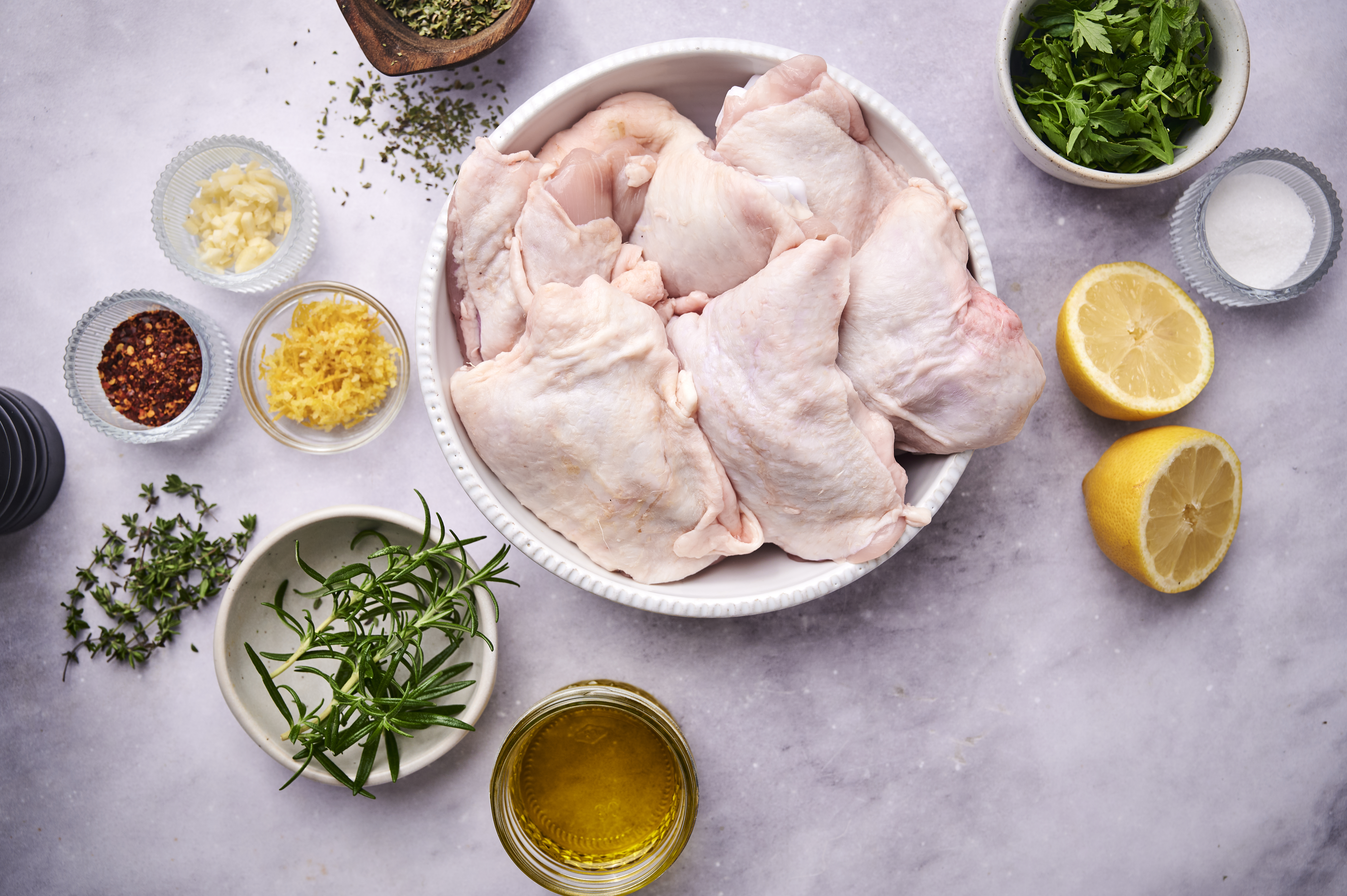 Raw ingredients for herby chicken thigh recipe 