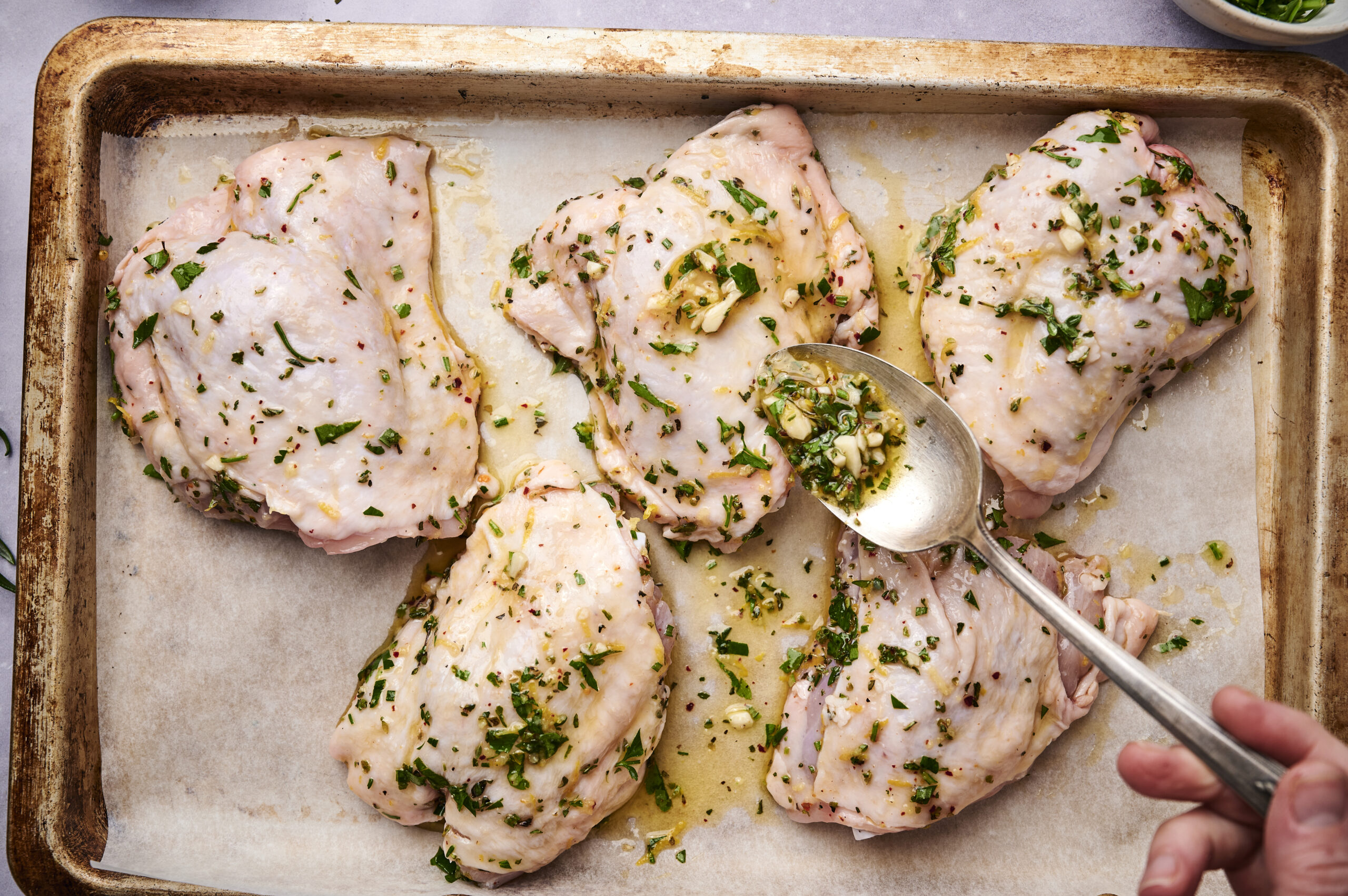 Herby sheet pan chicken thighs preparation