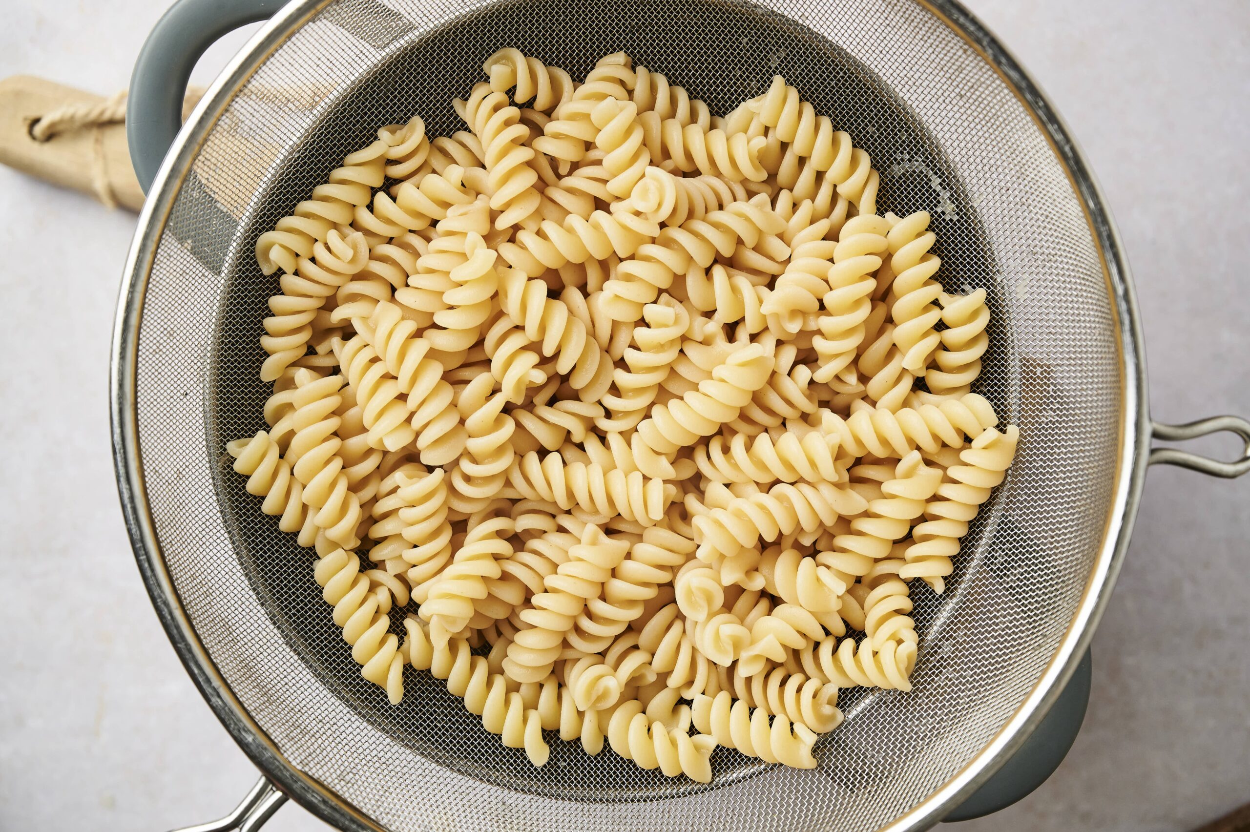 Cooked pasta in colander 