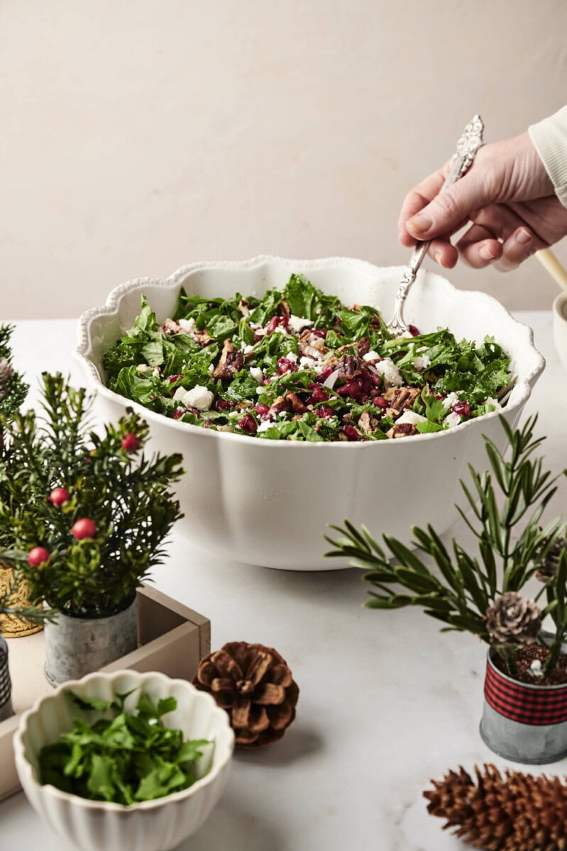 Kale salad in white bowl on table 