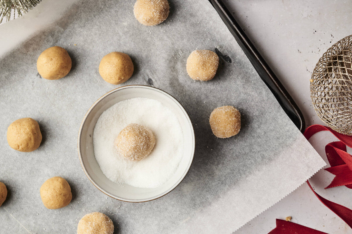 Rolling cookie dough in sugar 