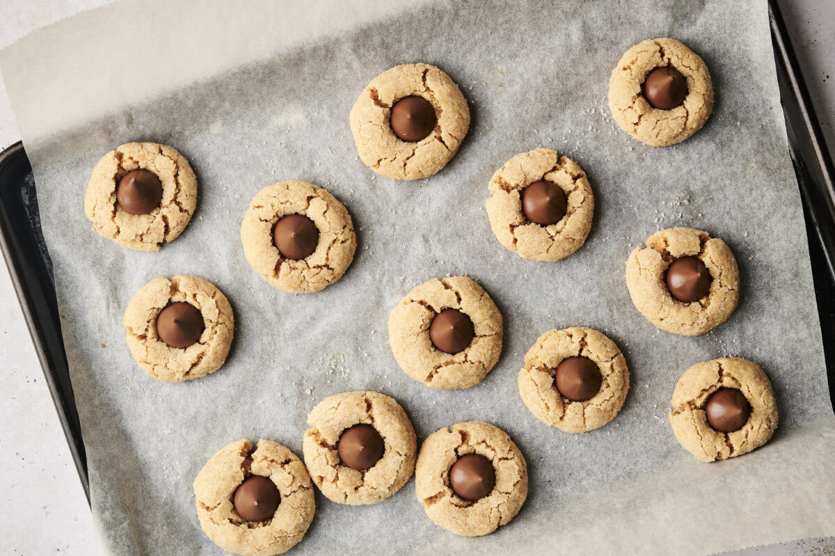 Finished peanut butter blossom cookies on baking sheet 