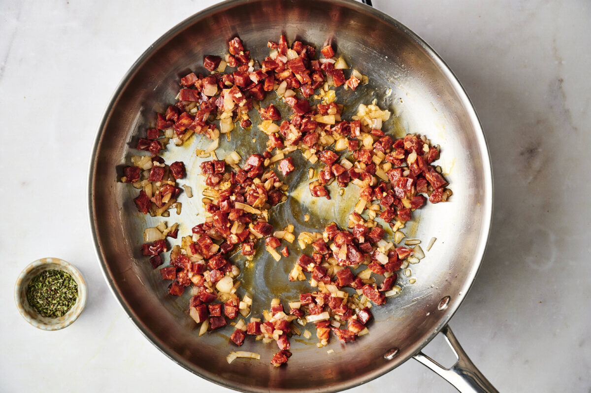 Onion and chorizo cooking in pan