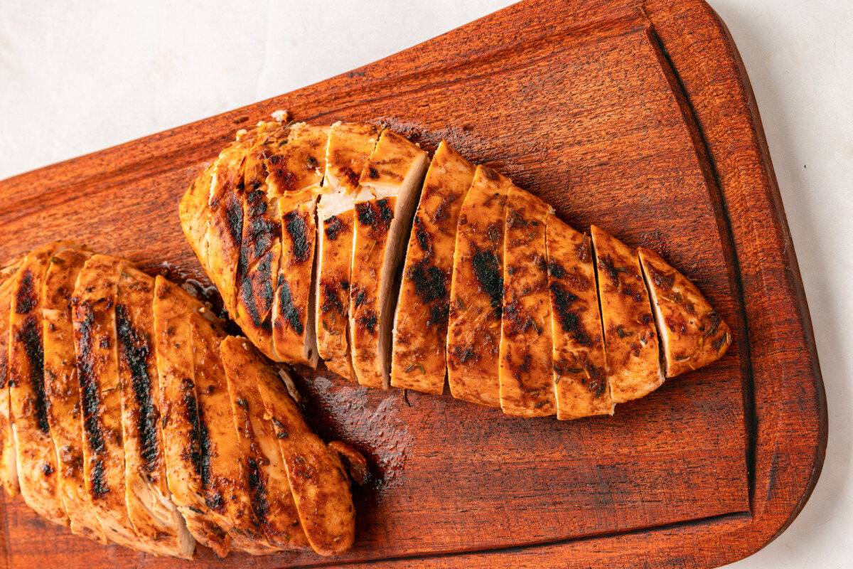 Jerk chicken resting on cutting board