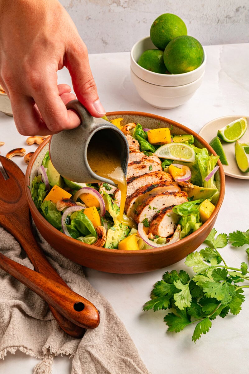 Pouring dressing on salad